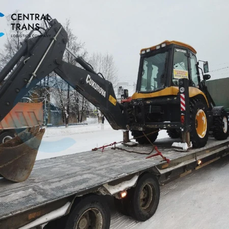 Перевозка фронтального экскаватора погрузчика CUKUROVA 888 на трале по направлению Красноярск - Омск
