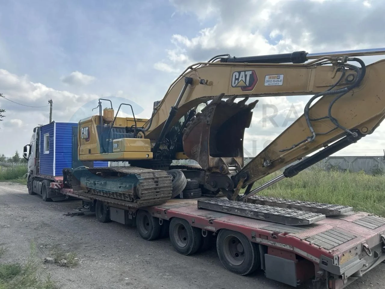 Перевозка экскаватора Caterpillar 320 и бытовки из Иркутска в Курган